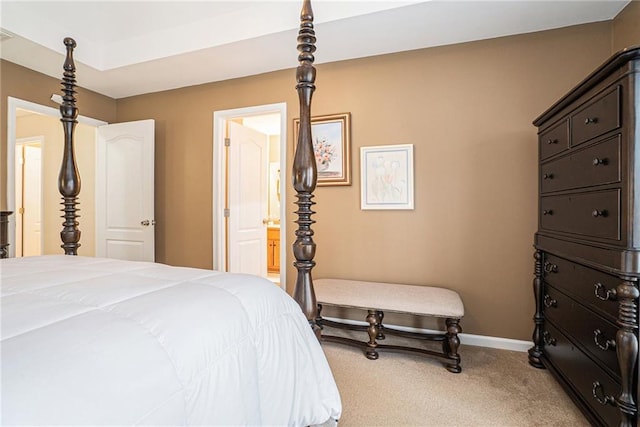 carpeted bedroom with ensuite bath