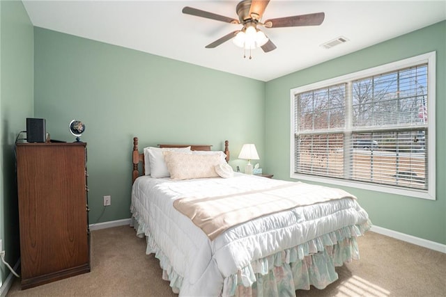 bedroom featuring light carpet and ceiling fan