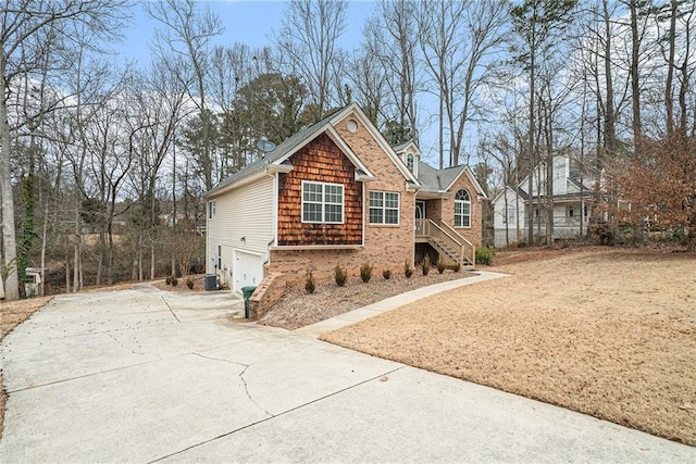 view of front of property with a garage and central air condition unit