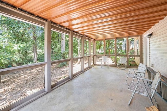 unfurnished sunroom with plenty of natural light