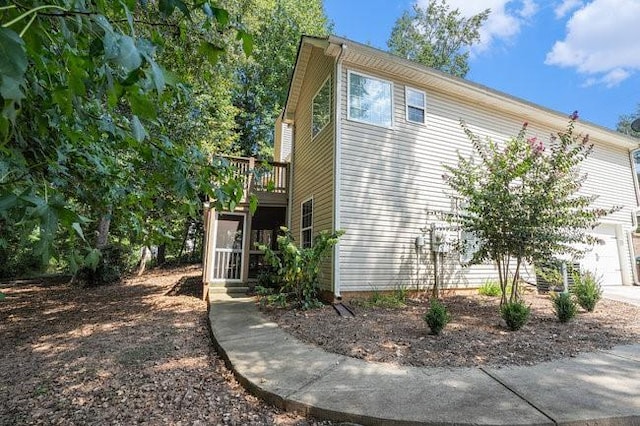 view of side of property featuring a deck