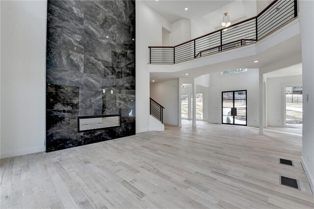 interior space with an inviting chandelier and light hardwood / wood-style flooring