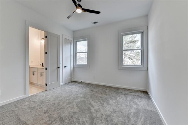 empty room featuring light colored carpet