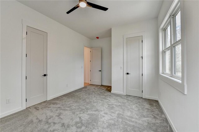 unfurnished bedroom with light colored carpet