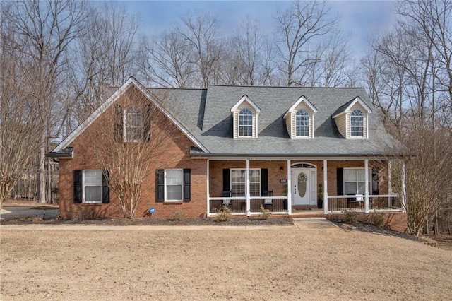 cape cod home with covered porch