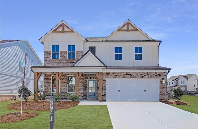 view of front of property featuring a front lawn, board and batten siding, concrete driveway, an attached garage, and brick siding