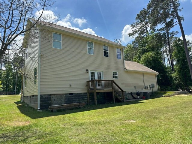 back of house with a lawn, french doors, crawl space, and a deck