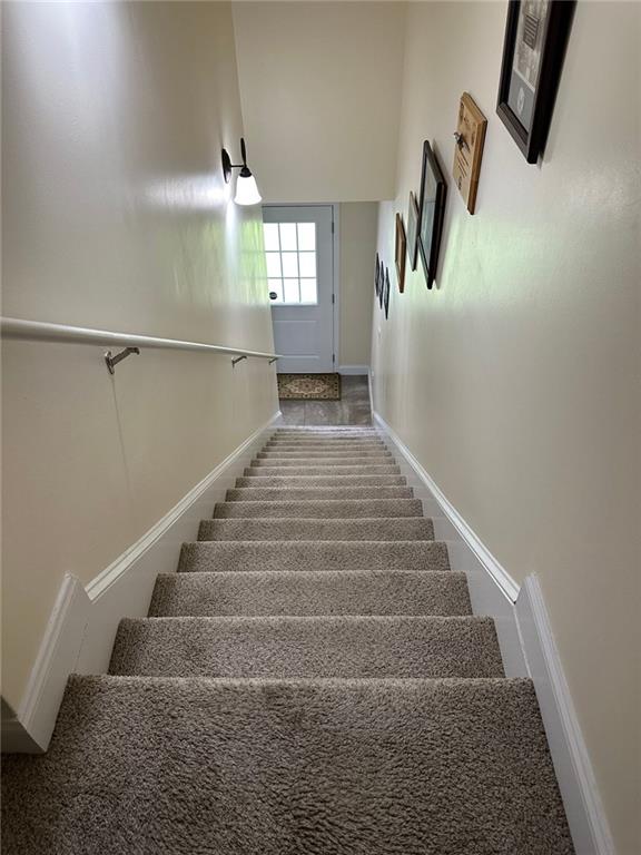 stairs featuring baseboards