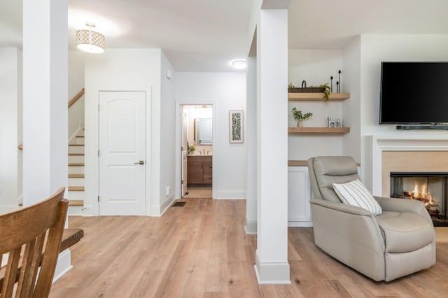 1013 Liberty Springs Dr, Woodstock, GA 30188 - corridor featuring light wood-type flooring and stairway