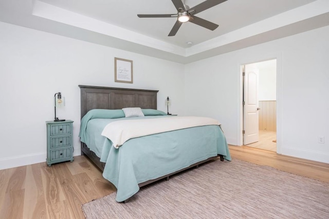 1013 Liberty Springs Dr, Woodstock, GA 30188 - bedroom with a raised ceiling, light wood finished floors, baseboards, and a ceiling fan
