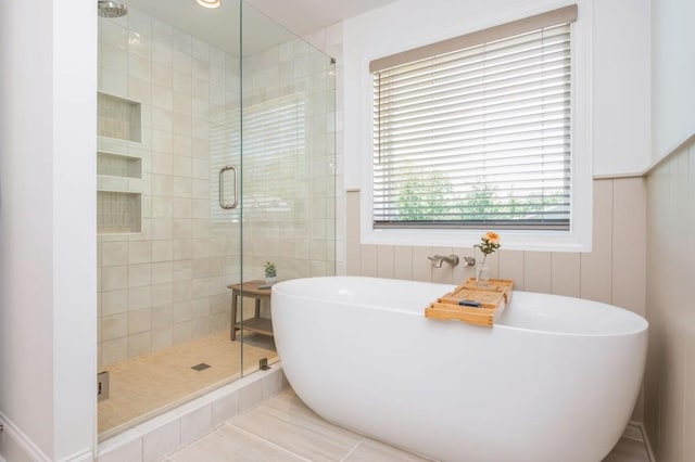 1013 Liberty Springs Dr, Woodstock, GA 30188 - bathroom featuring a freestanding tub, a stall shower, and tile patterned flooring