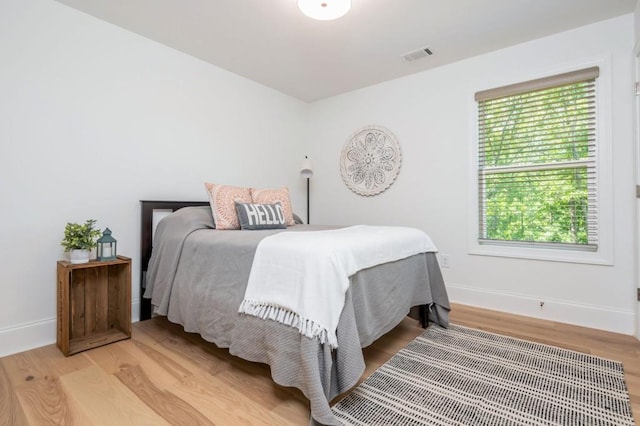 1013 Liberty Springs Dr, Woodstock, GA 30188 - bedroom with light wood finished floors and baseboards