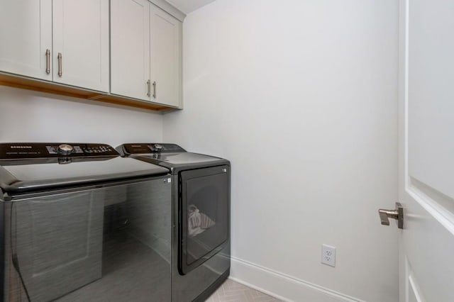 1013 Liberty Springs Dr, Woodstock, GA 30188 - laundry room featuring washer and dryer, cabinet space, and baseboards