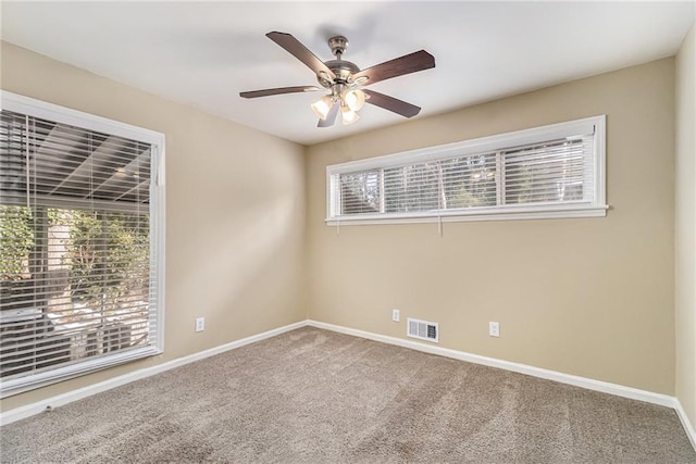 carpeted empty room with ceiling fan