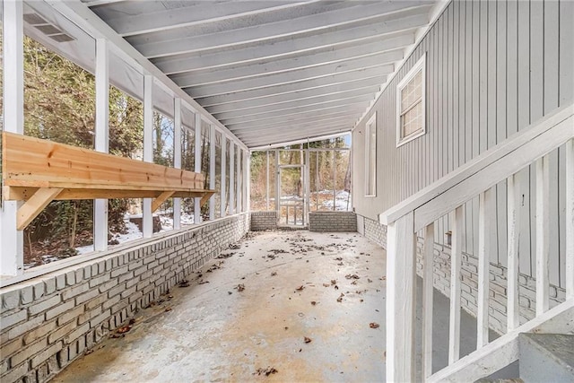 unfurnished sunroom with vaulted ceiling