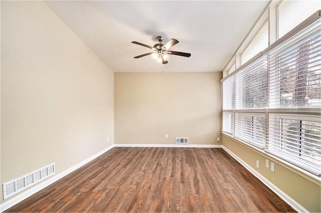 unfurnished room featuring ceiling fan and dark wood-type flooring