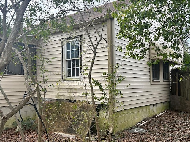 view of side of property featuring crawl space