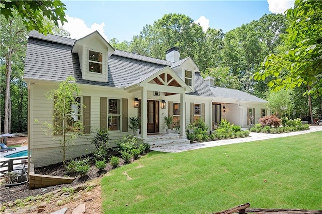 12410 Charlotte Dr, Alpharetta, GA 30004 - view of front facade featuring a front lawn, concrete driveway, a shingled roof, a chimney, and a garage