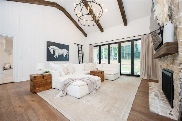 12410 Charlotte Dr, Alpharetta, GA 30004 - living area featuring a stone fireplace and wood finished floors