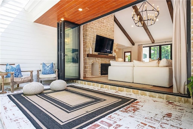 12410 Charlotte Dr, Alpharetta, GA 30004 - living room with a chandelier and a stone fireplace