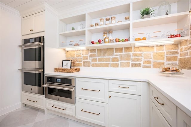 12410 Charlotte Dr, Alpharetta, GA 30004 - kitchen featuring light countertops, white cabinets, stainless steel microwave, and open shelves