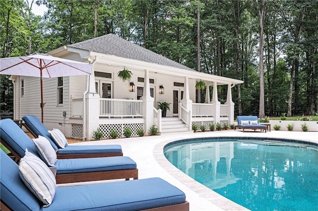 12410 Charlotte Dr, Alpharetta, GA 30004 - outdoor pool featuring a porch and view of wooded area