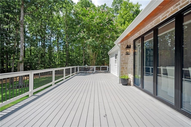 12410 Charlotte Dr, Alpharetta, GA 30004 - wooden terrace with view of wooded area