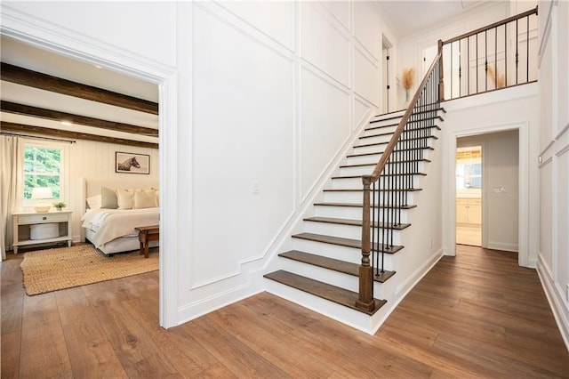 12410 Charlotte Dr, Alpharetta, GA 30004 - stairway with wood finished floors and beamed ceiling