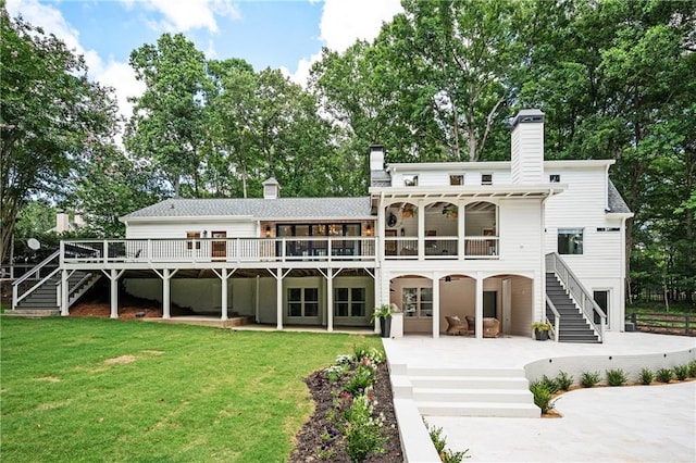 12410 Charlotte Dr, Alpharetta, GA 30004 - back of property featuring stairs, a patio area, a chimney, and a yard