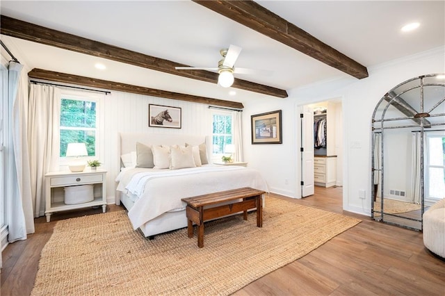 12410 Charlotte Dr, Alpharetta, GA 30004 - bedroom featuring wood finished floors, beam ceiling, recessed lighting, a spacious closet, and ceiling fan