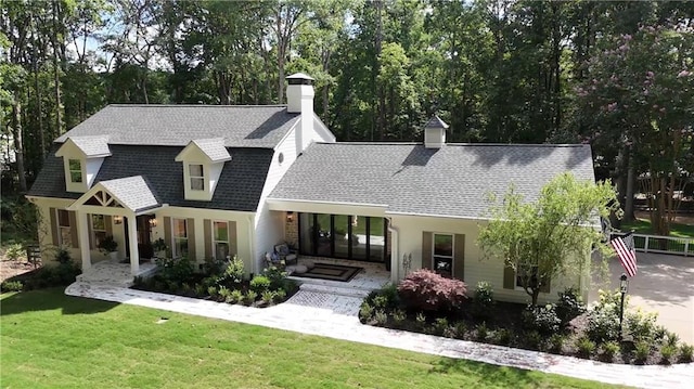 12410 Charlotte Dr, Alpharetta, GA 30004 - rear view of house featuring a chimney, a shingled roof, and a yard