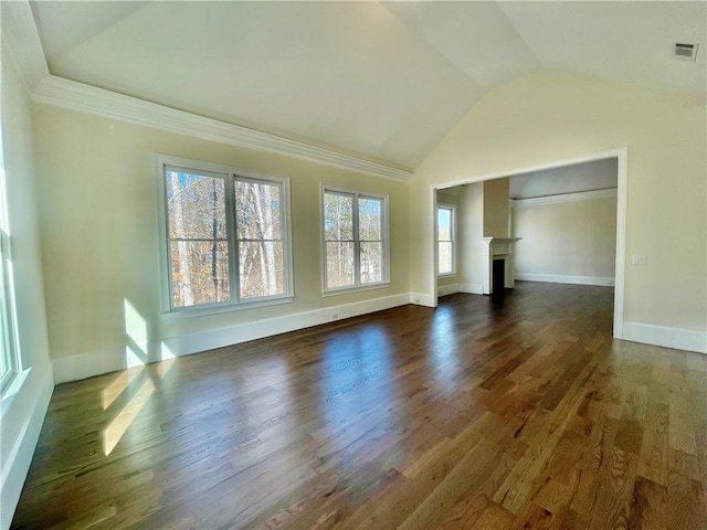 unfurnished living room featuring vaulted ceiling and dark wood-type flooring