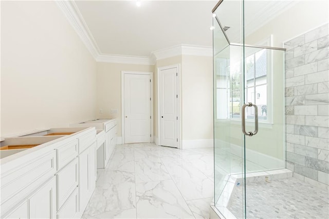 bathroom with vanity, ornamental molding, and a shower with door