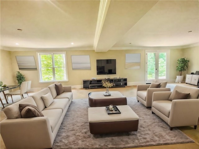 living room featuring beam ceiling and ornamental molding