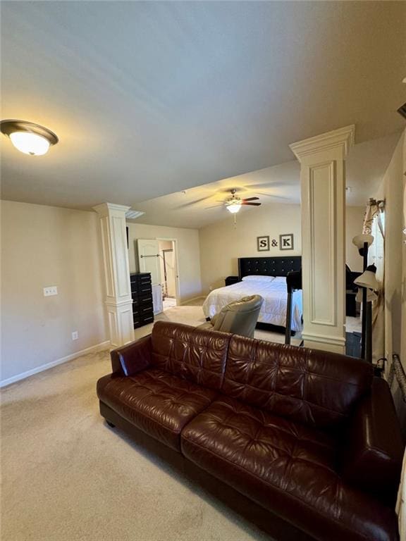 living room with ceiling fan, carpet, decorative columns, and baseboards