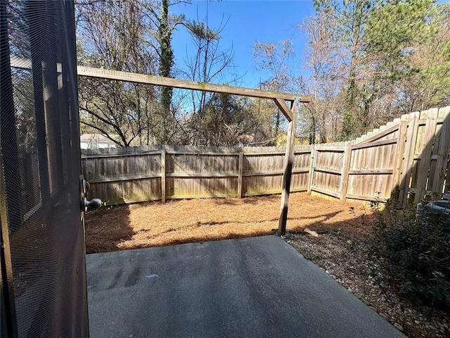 view of yard with a fenced backyard and a patio