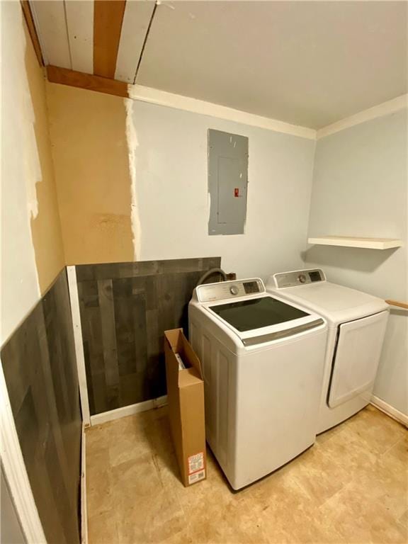 washroom with laundry area, electric panel, ornamental molding, and washer and dryer