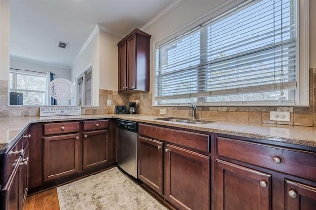 kitchen featuring sink, backsplash, ornamental molding, light stone countertops, and stainless steel dishwasher