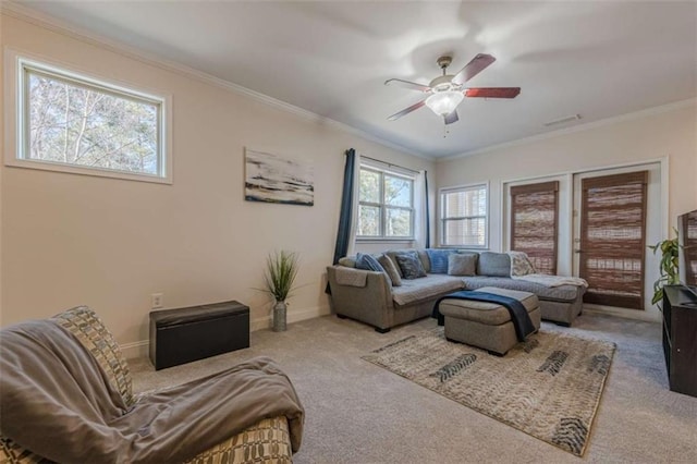 living room with crown molding, carpet, and ceiling fan