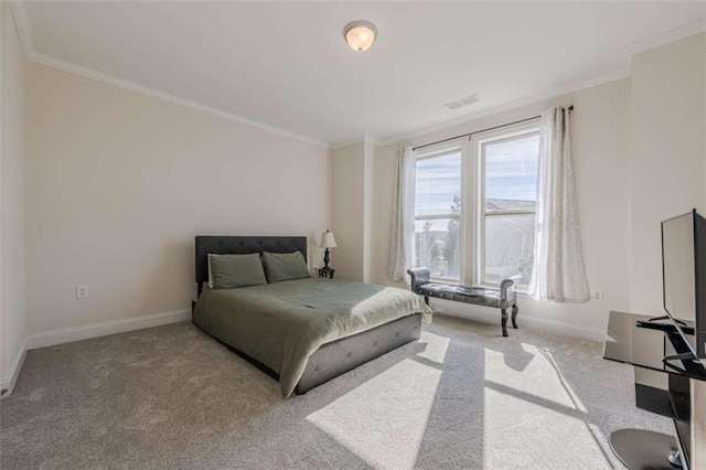 bedroom with ornamental molding and light carpet