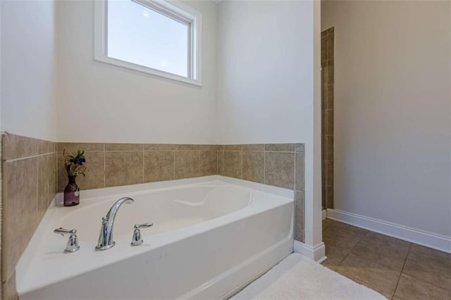 bathroom featuring tile patterned flooring and a bathtub