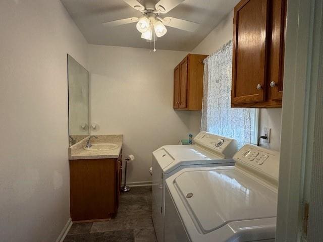 washroom with washing machine and dryer, ceiling fan, and sink