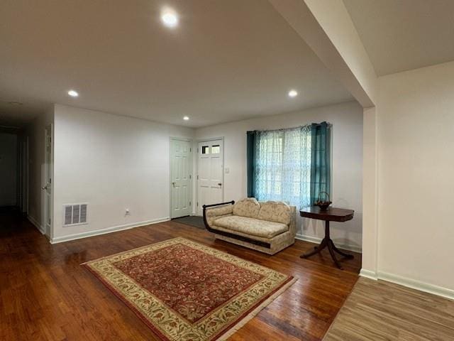 living room featuring dark hardwood / wood-style flooring