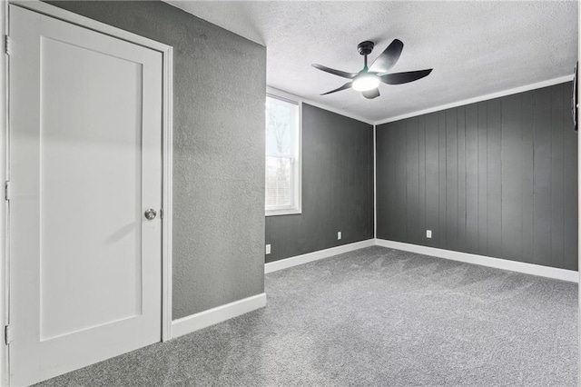 unfurnished room with carpet, a textured ceiling, and ceiling fan