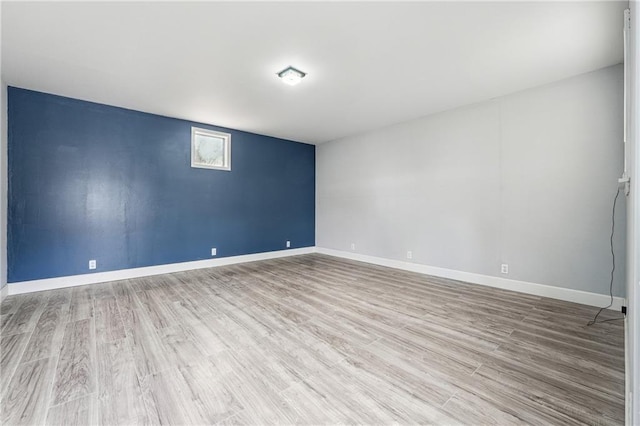 unfurnished room with wood-type flooring