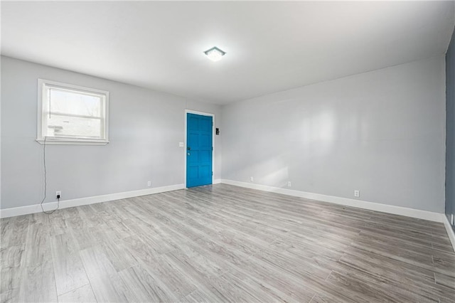 spare room with light wood-type flooring