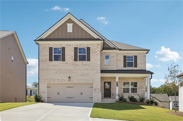 craftsman house featuring a garage and a front lawn