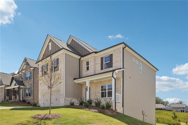 view of front of home featuring a garage and a front lawn