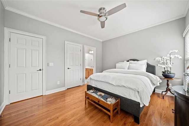 bedroom featuring wood-type flooring, ornamental molding, and ensuite bathroom