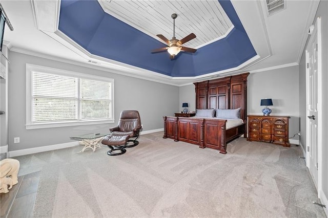 bedroom with a raised ceiling, crown molding, light carpet, and ceiling fan